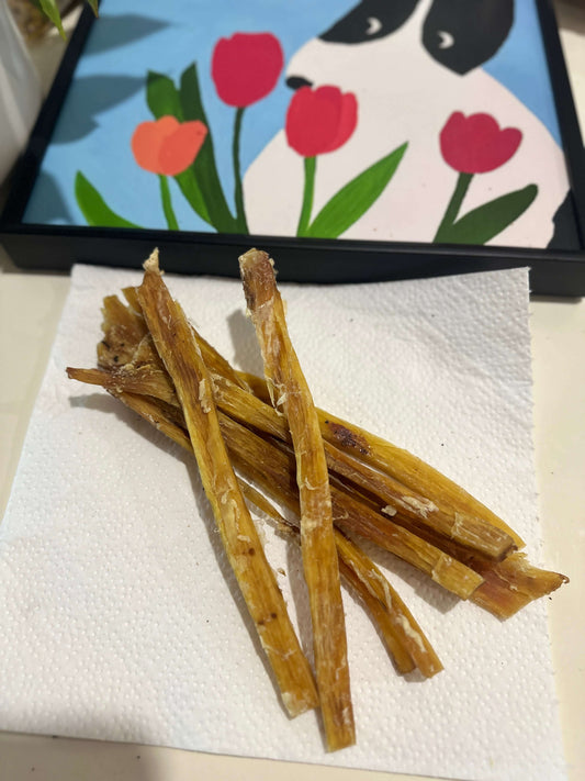 Beef Tendon Strips 1Kg 100% Australian Natural Dog Dental Treats Free Post on a paper towel.