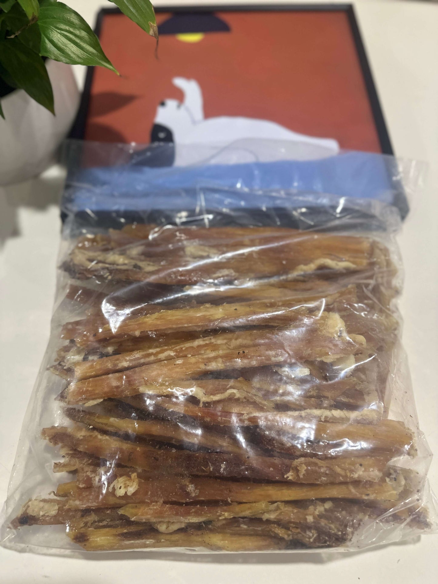 Beef Tendon Strips 1Kg 100% Australian Natural Dog Dental Treats Free Post in a clear bag on table.